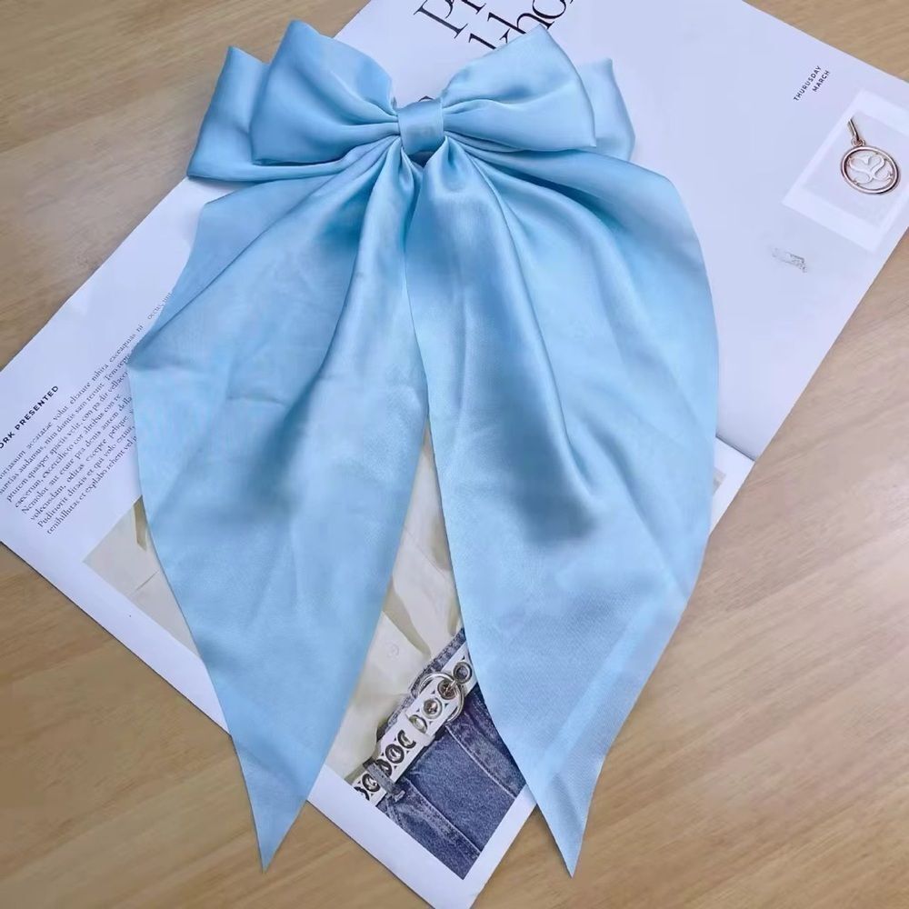 Oversized blue bow